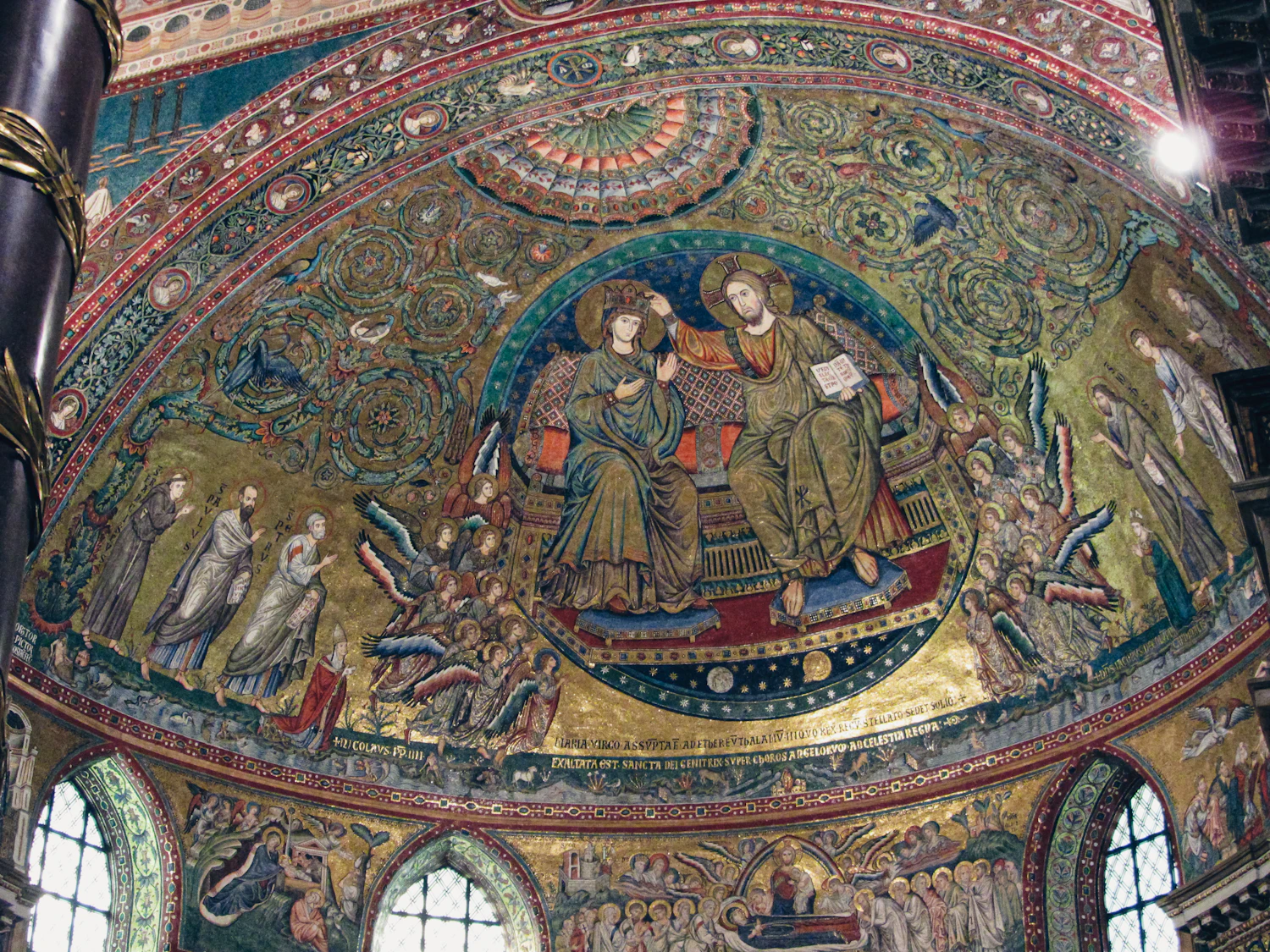 A gold-ground mosaic showing two robed donors in procession