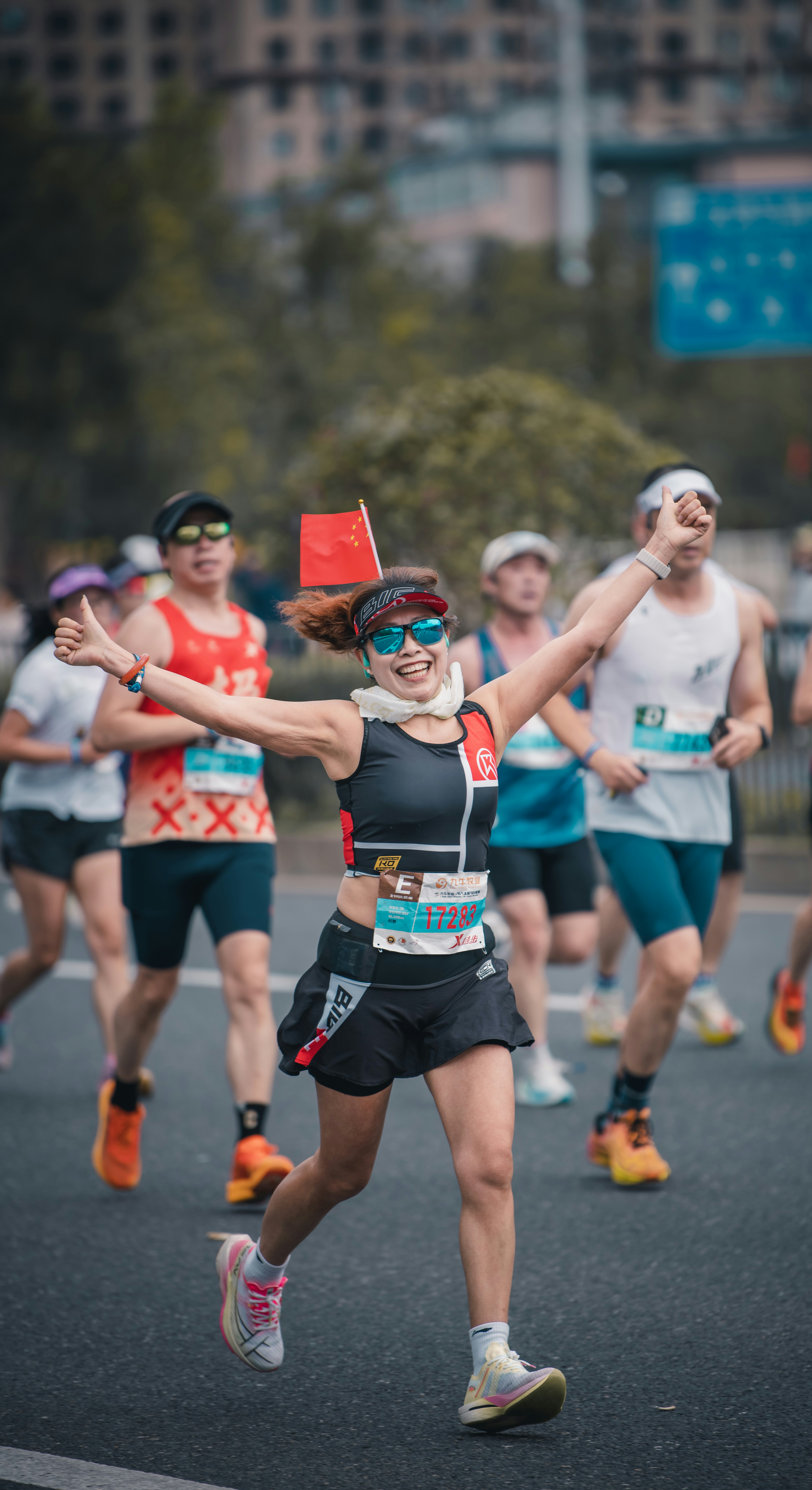 A group of people celebrating a fitness achievement.