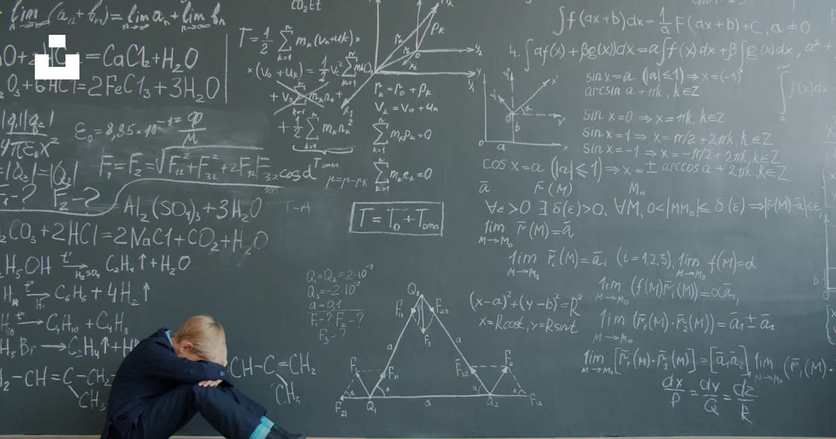Sad Math Student Student sits by blackboard covered in math equations photo – Free Sad ...
