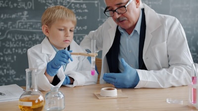 Teacher and student conducting science experiment in classroom.