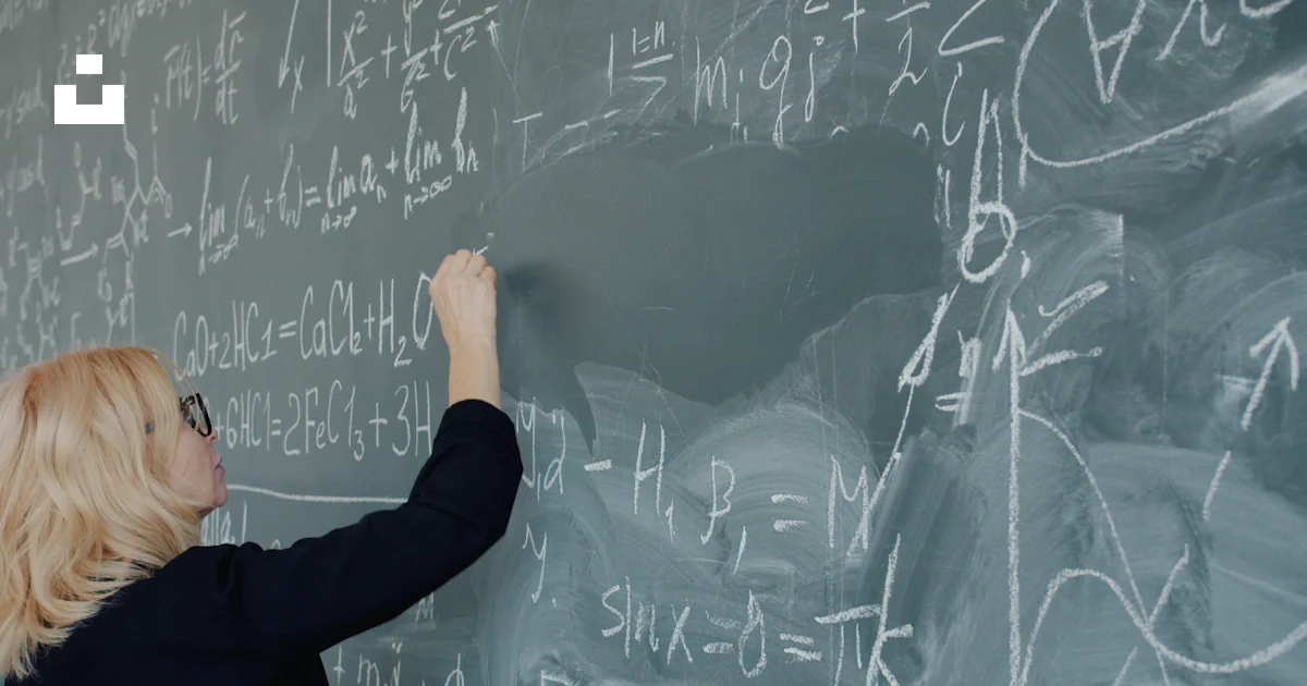 Person Writing Math Woman writing complex mathematical equations on a chalkboard. photo ...