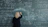 Woman writing complex mathematical formulas on a chalkboard.