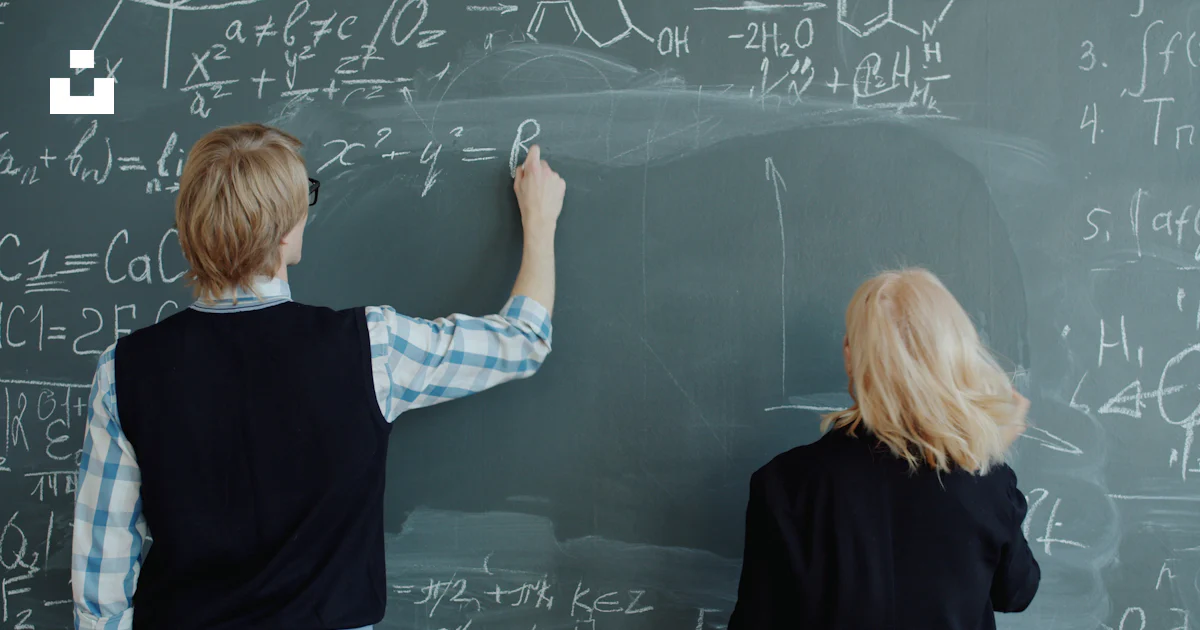 Person Writing Math Two people writing math formulas on a chalkboard. photo – Free ...