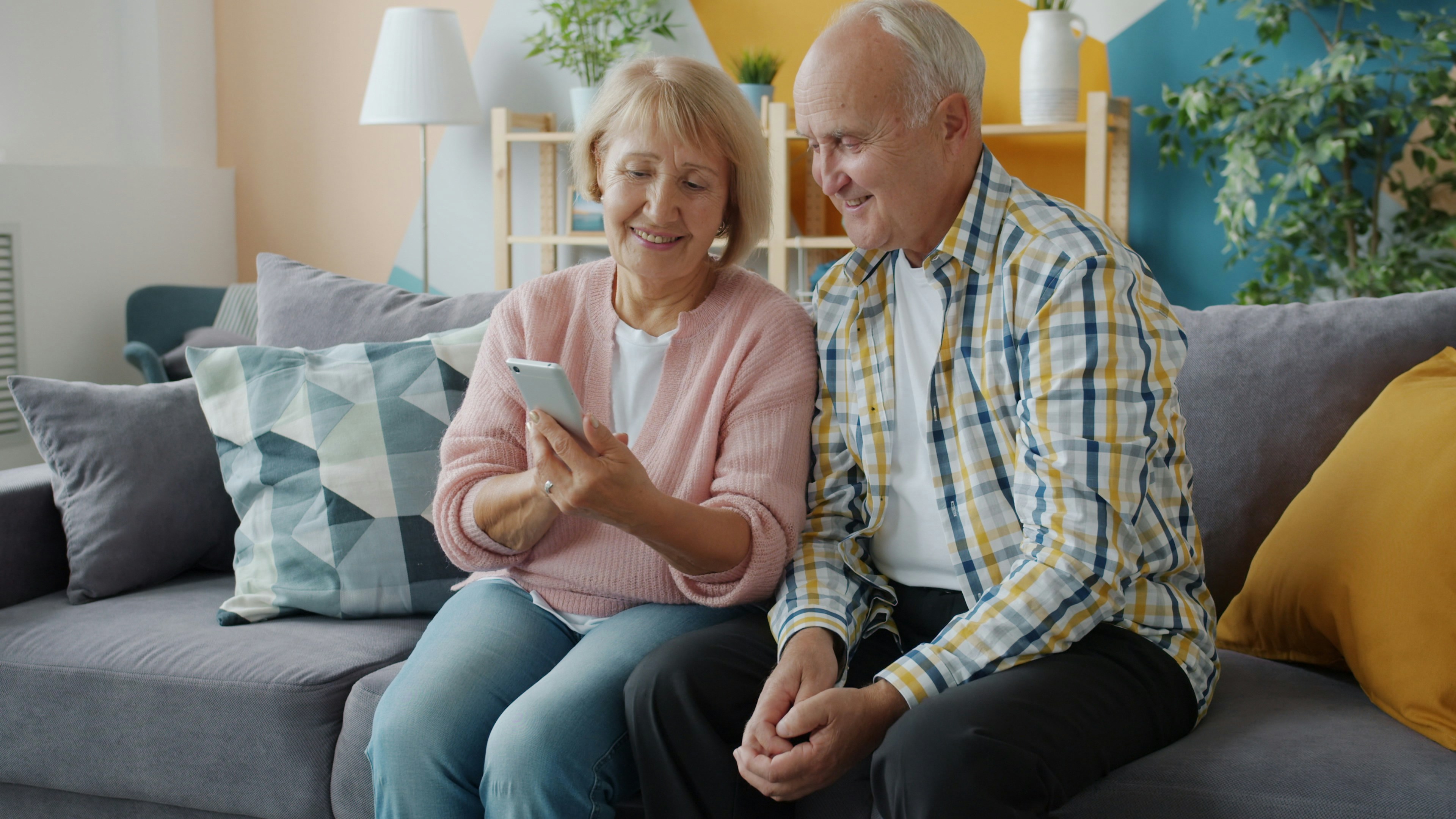 Senior couple enjoying smartphone together