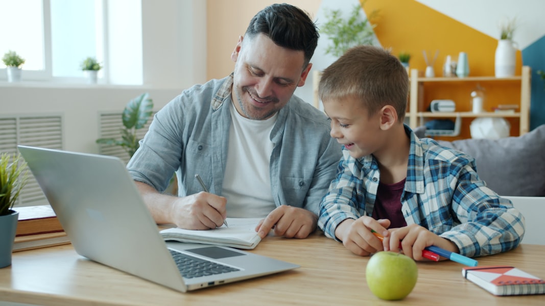 Father and son studying together in a calm, focused environment