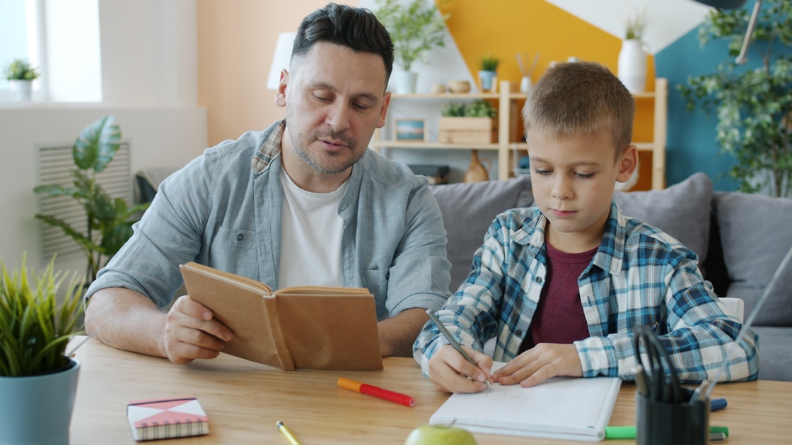Parent and child reading together at table - dyslexia support Sydney