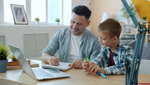 Father and son working together at a desk