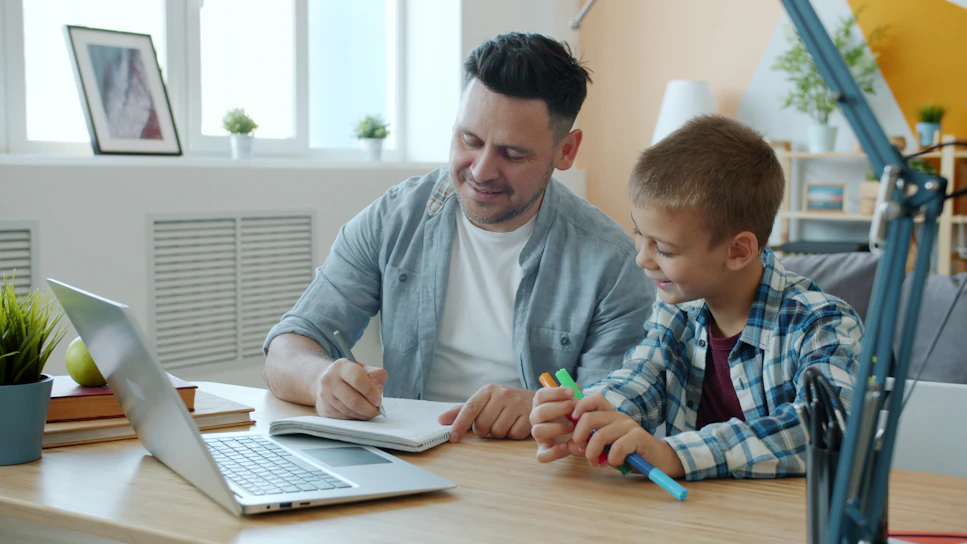 Father and son working together at a desk