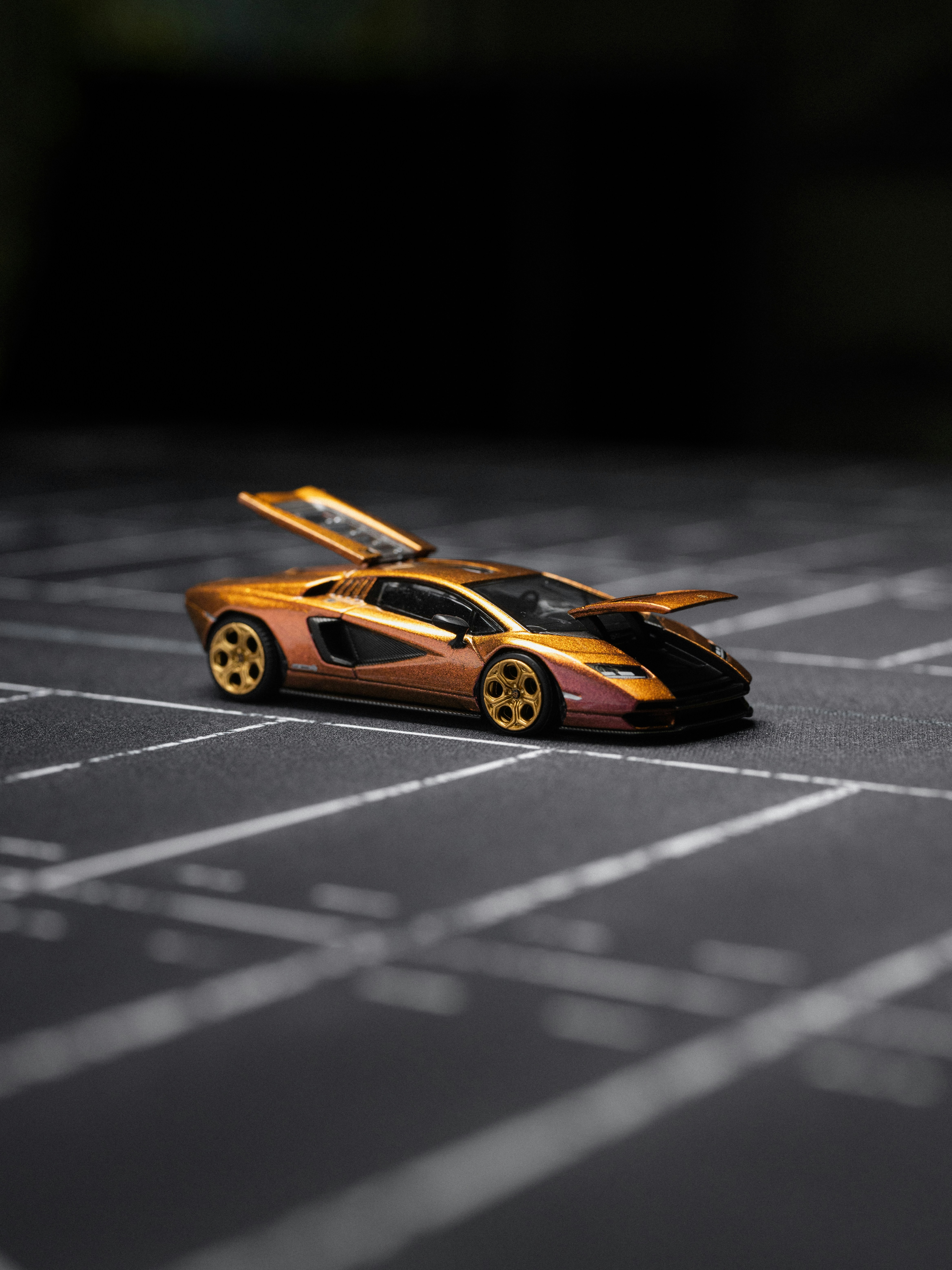 A detailed model of a sports car with doors open.