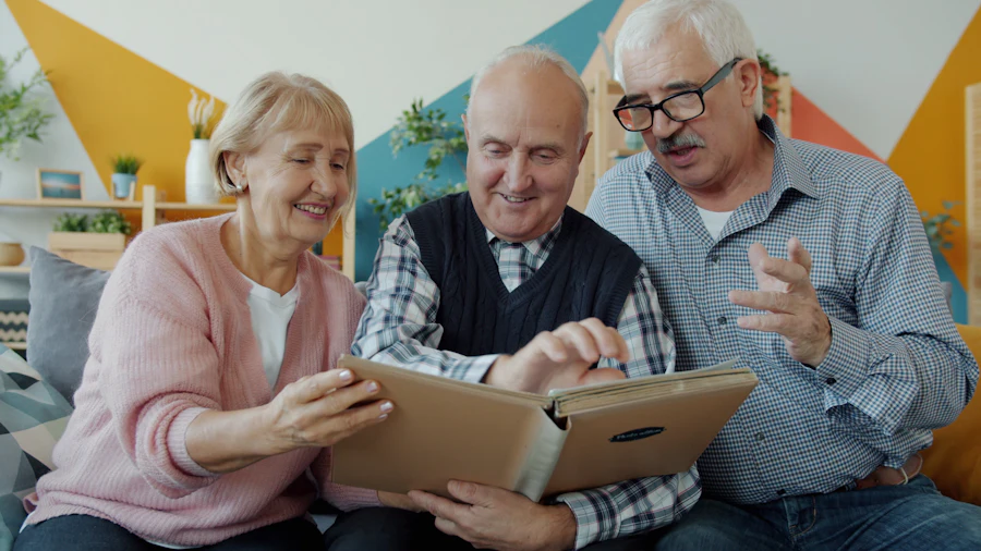 Three older friends looking at a photo album together