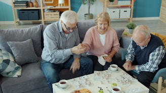 Three seniors enjoying a puzzle together