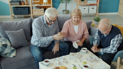Three seniors enjoying a puzzle together