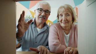 Elderly couple looking into a cardboard box
