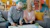 Elderly couple reviewing documents at home