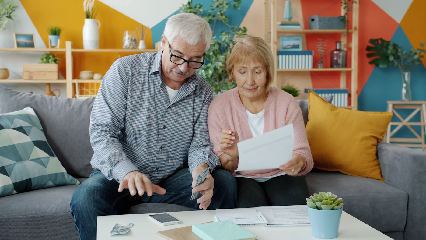 Older adults reviewing important documents at home