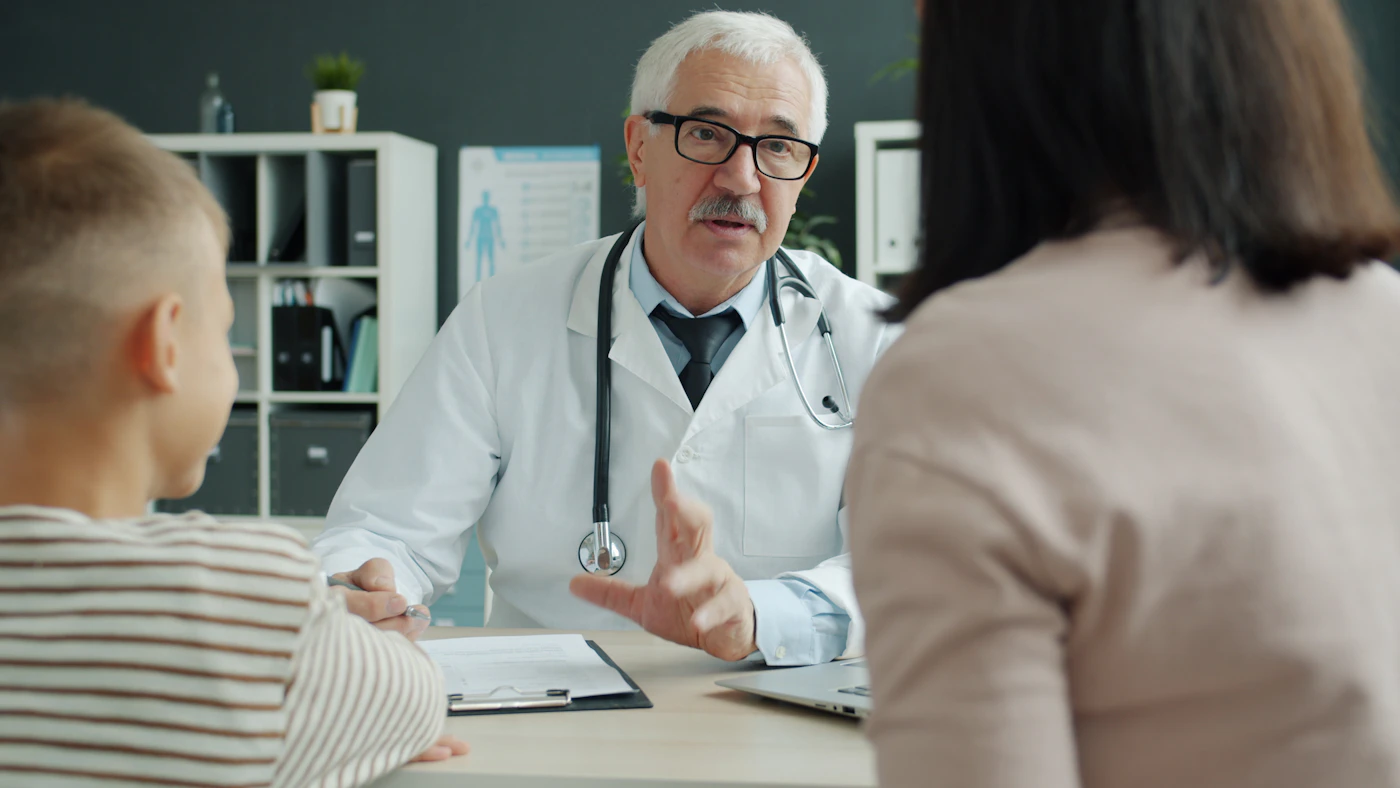 Clinician reviewing a care plan with patients at the Rehoboth clinic in Garland