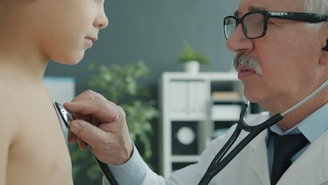 Doctor examines child's chest with stethoscope