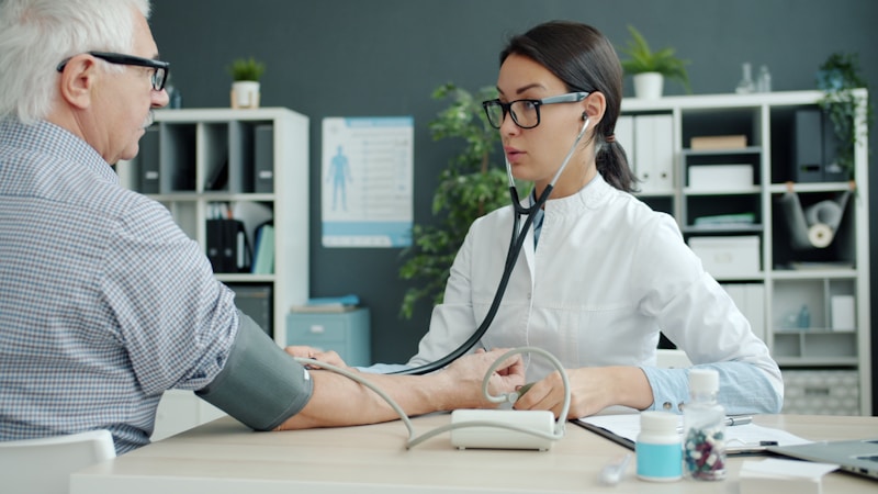 Doctor monitoring a patient during a medical check-up