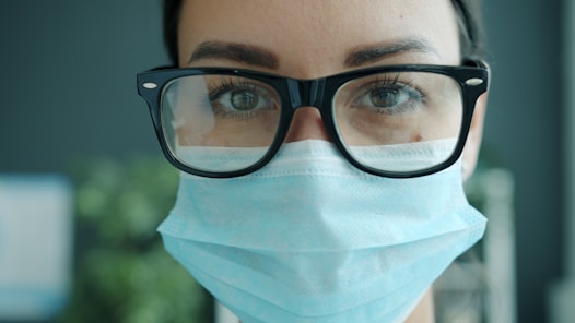 Woman wearing a face mask and glasses