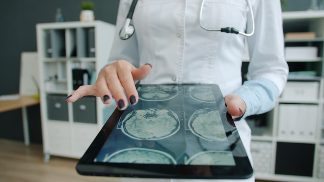 medical professional explaining brain scan showing addiction effects