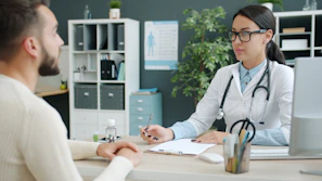 Doctor consulting with a patient in an office.