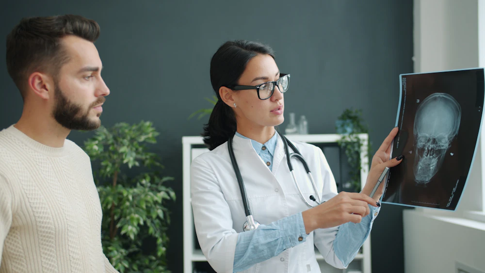 Doctor reviewing an X-ray with a patient