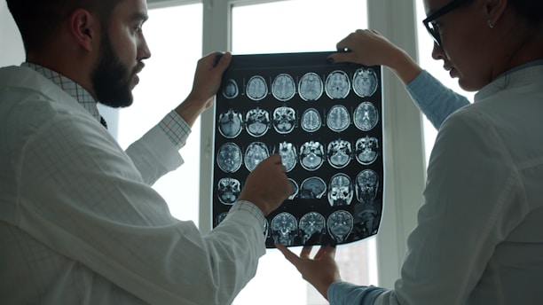 Doctors analyzing brain scans for neuropsychological assessment of brain health and organic function