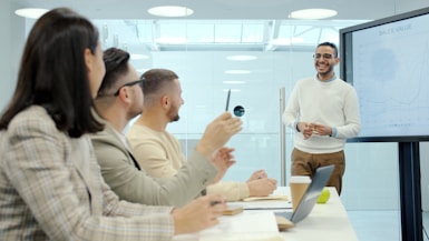 Man presenting to colleagues in a modern office setting