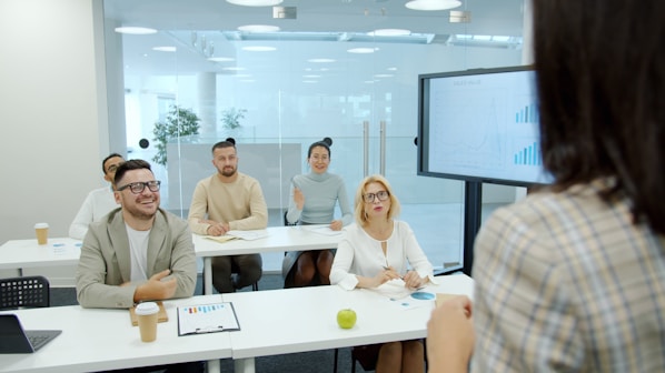 People listen attentively during a business presentation.