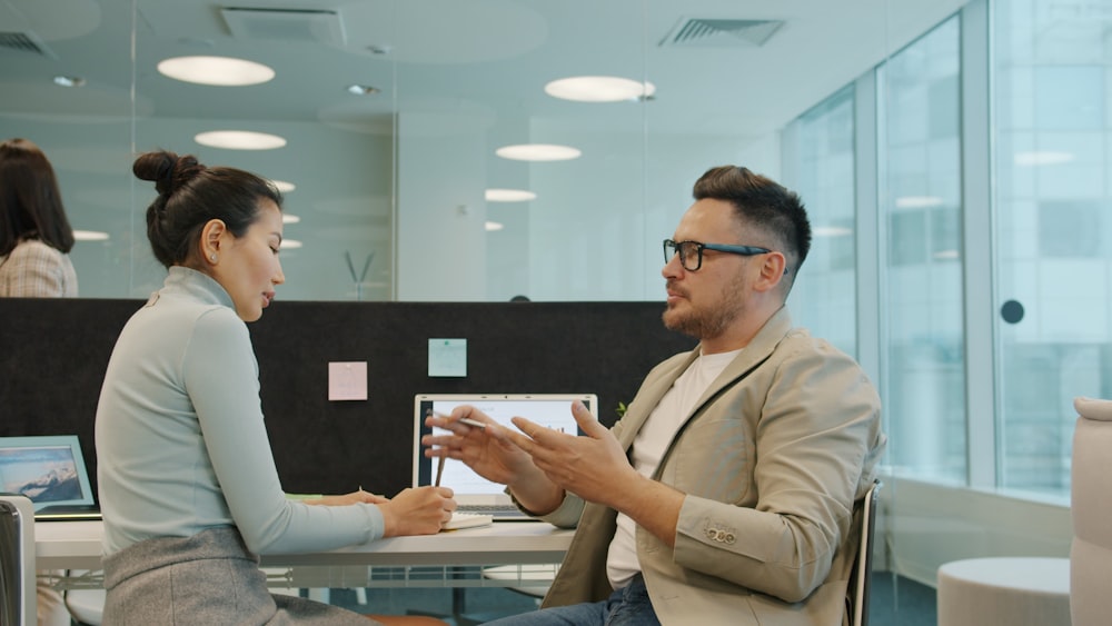 Two colleagues working through a portfolio together.