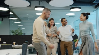 Colleagues dancing and celebrating in an office setting