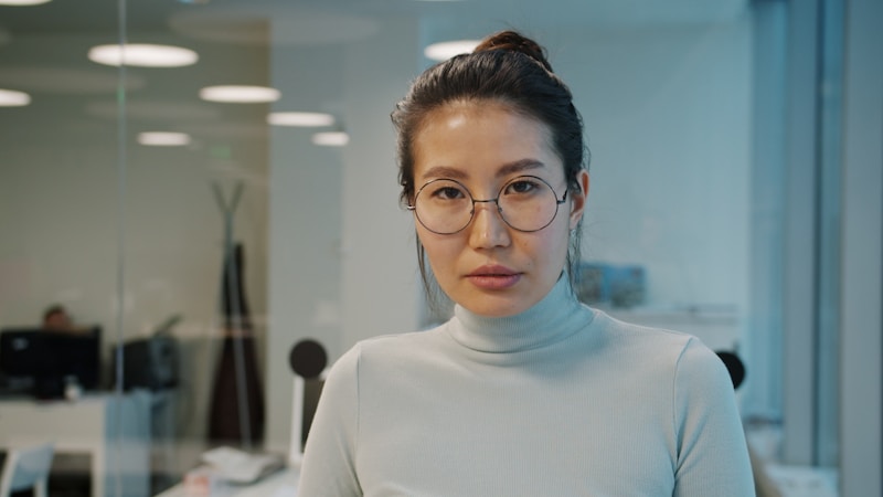 professional woman in office setting radiating success
