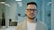 Man with glasses in a modern office setting