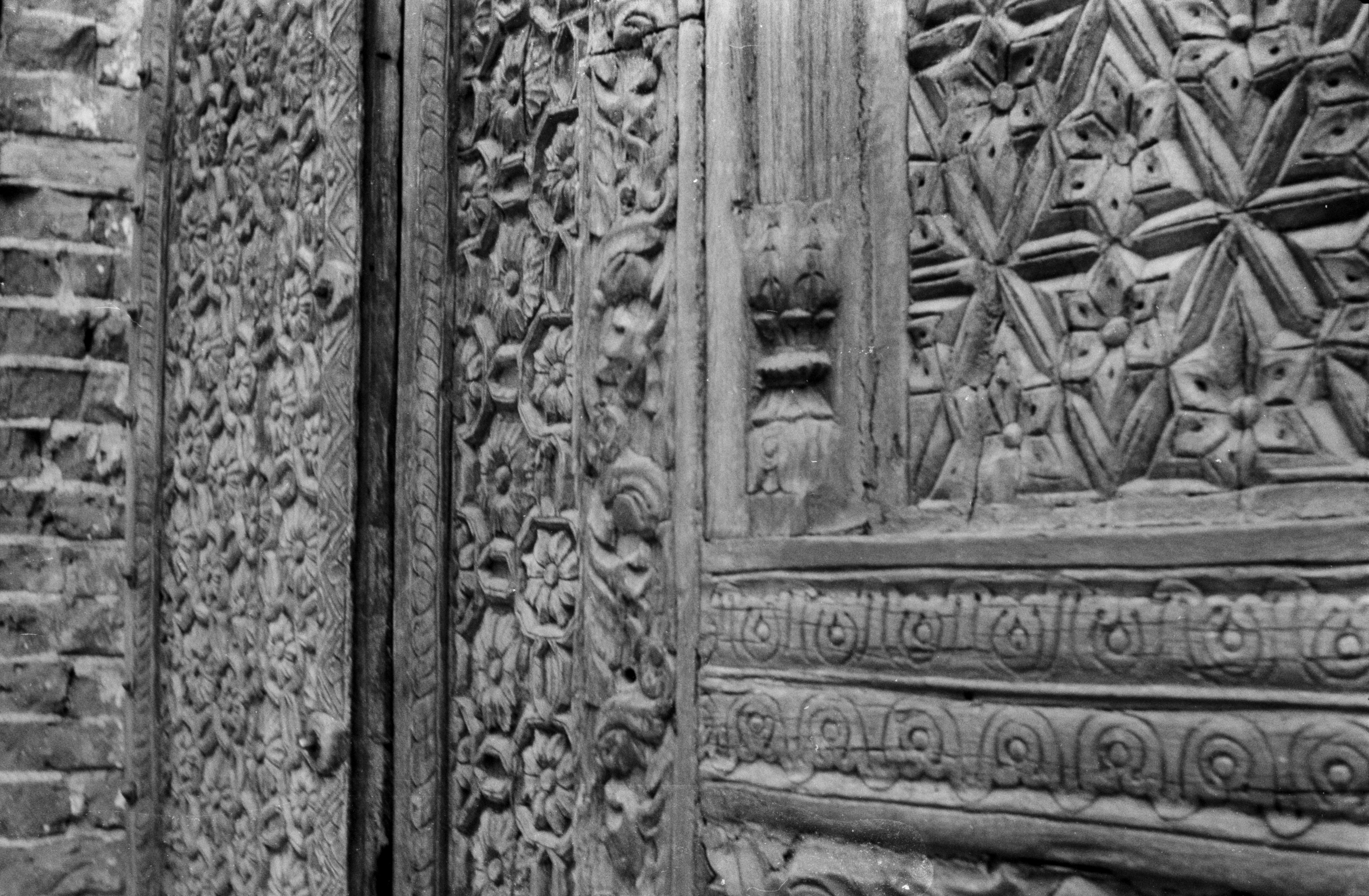Ornate wooden carvings on old door