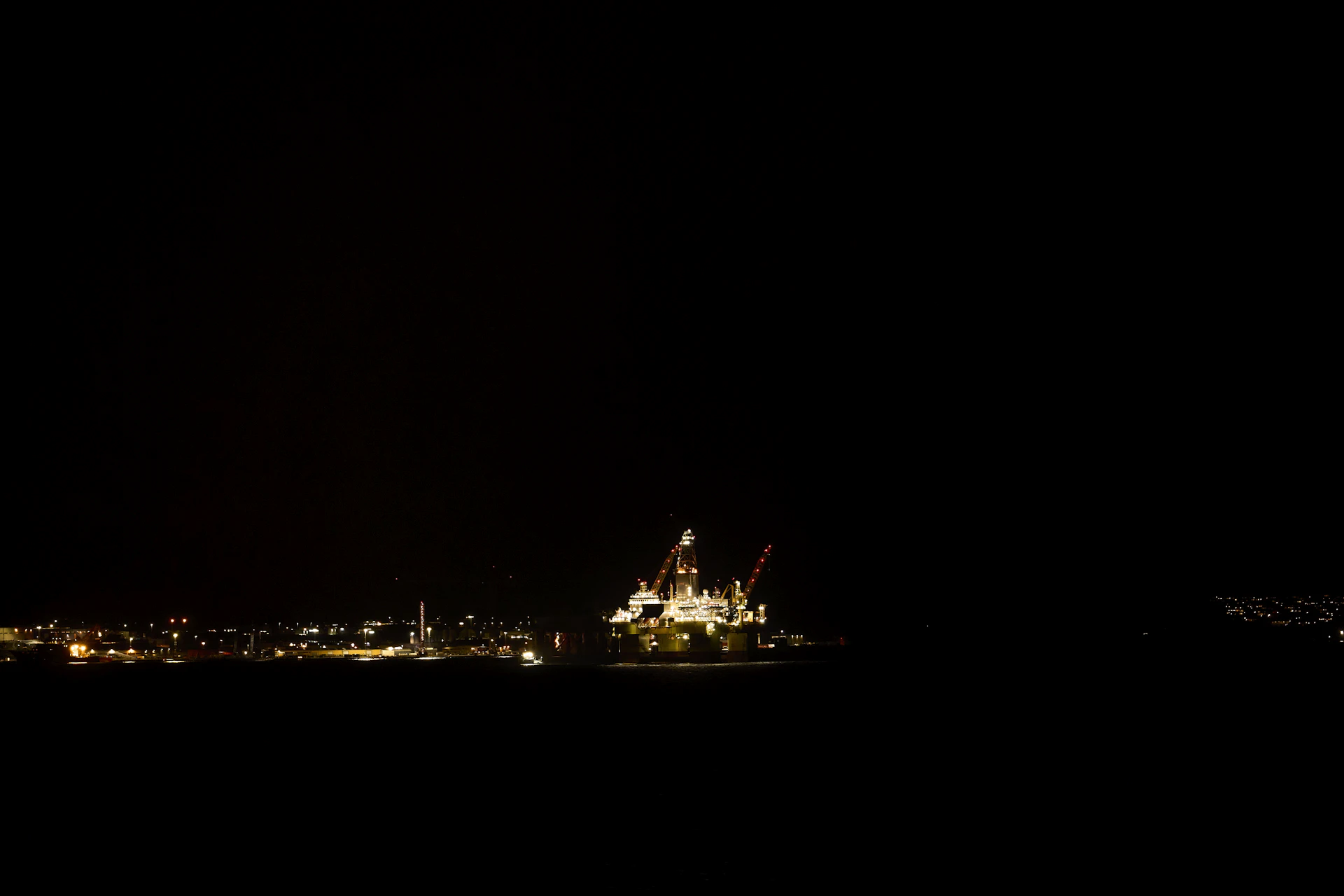 Offshore rig illuminated at night
