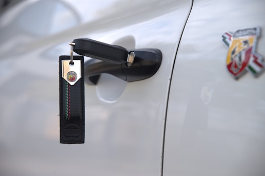 Car door with keys and keychain hanging keychain