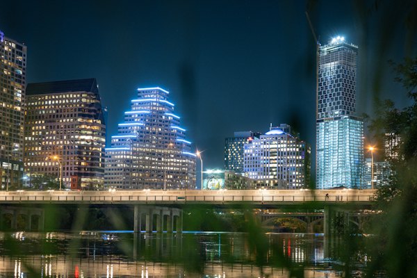Bright cityscape with illuminated buildings at night — Austin, United States