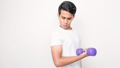 Man flexing bicep with purple dumbbell