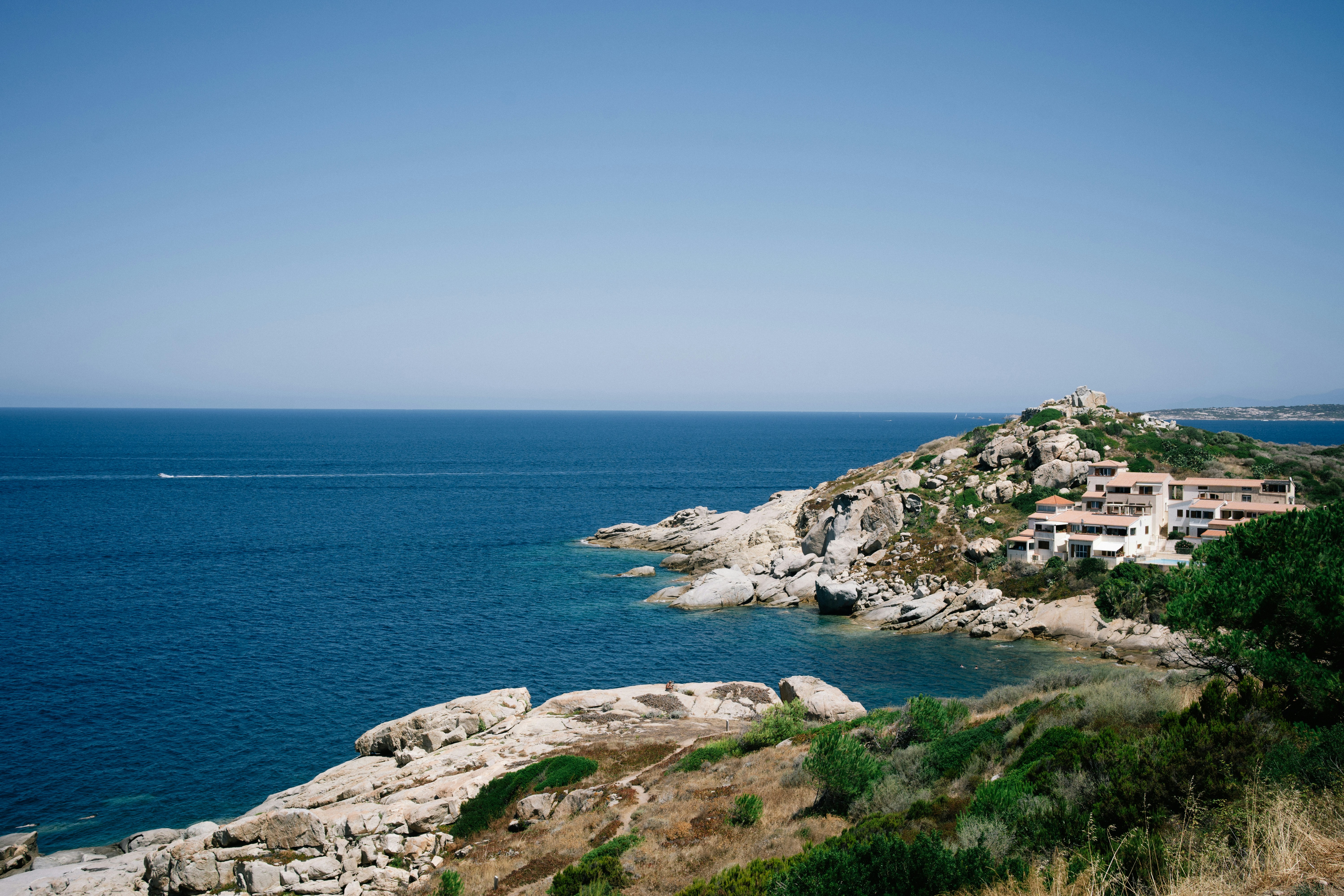 Coastal buildings on rocky mediterranean landscape