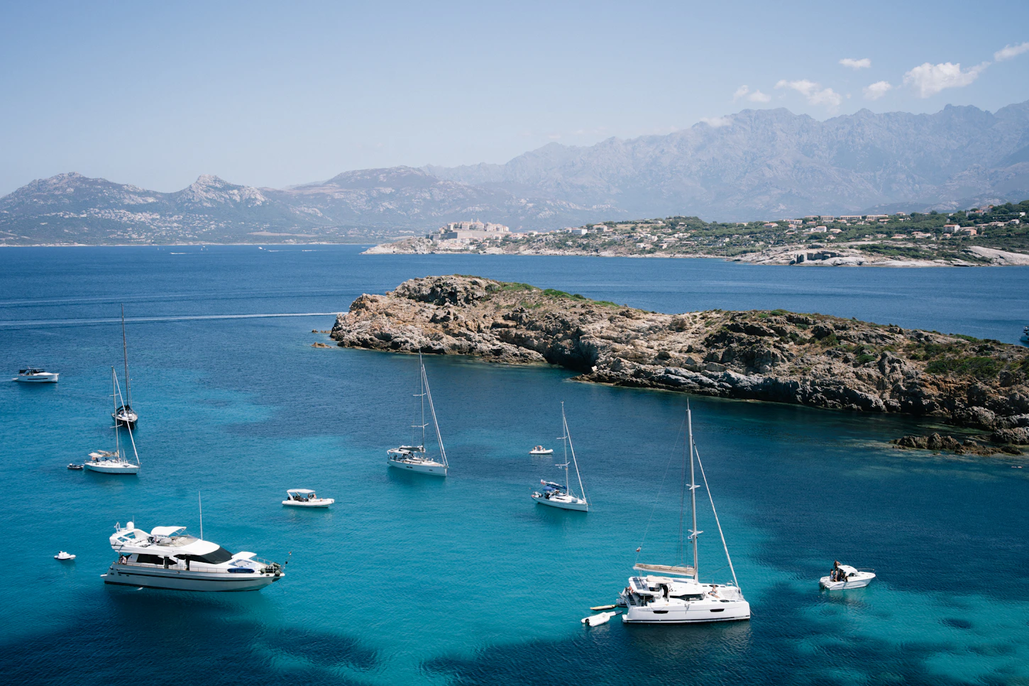 Sailboats at anchor in a sheltered bay