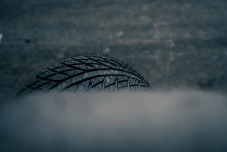 Close-up of a car tire in smoke