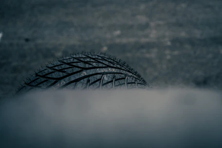 Close-up of a car tire in smoke