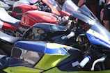 Row of colorful sport motorcycles parked together.