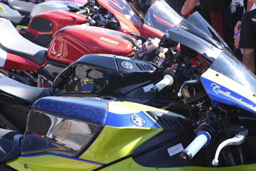 Row of colorful sport motorcycles parked together.