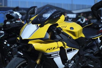 Yellow yamaha r1 motorcycle with white accents.