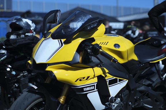 Yellow yamaha r1 motorcycle with white accents.