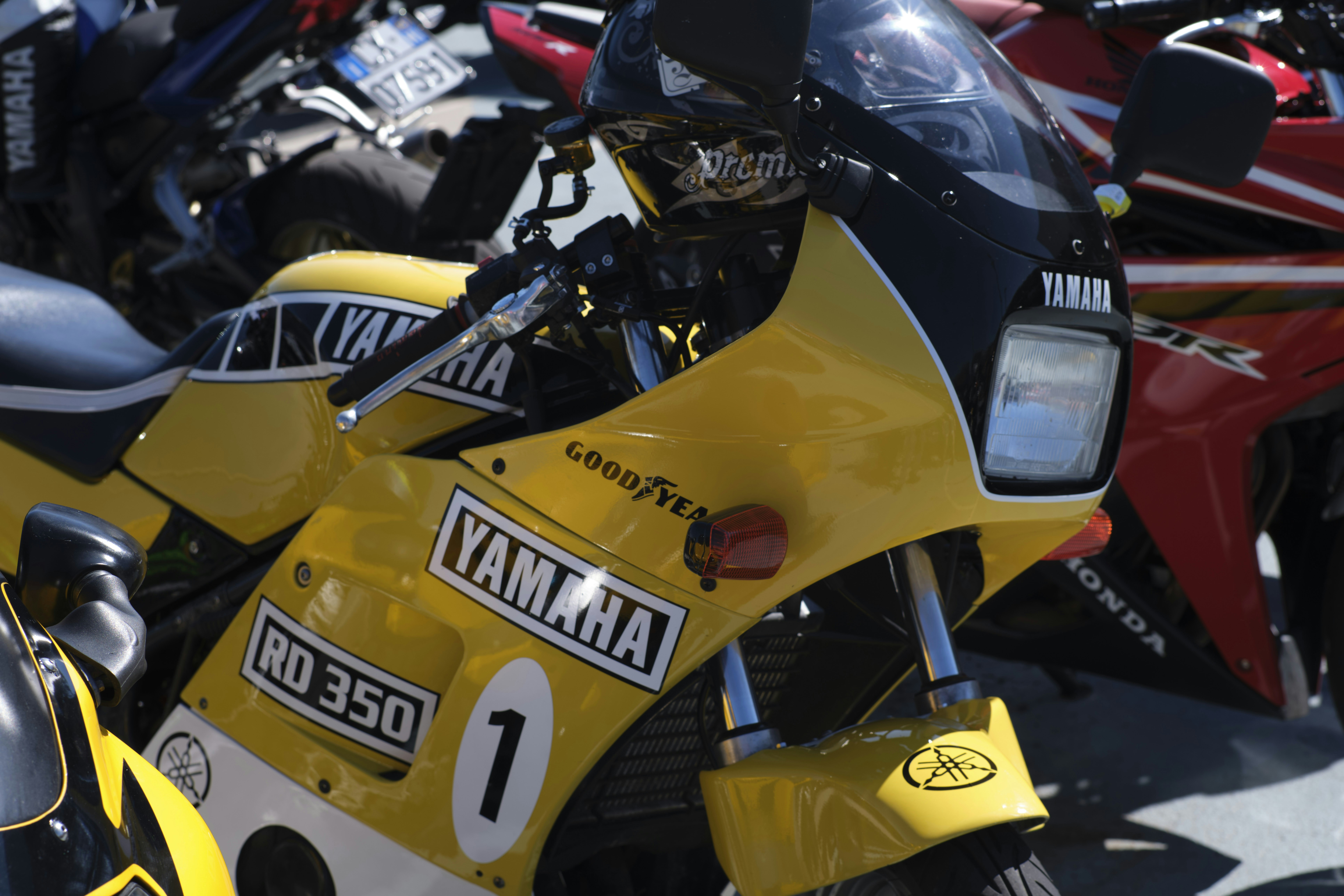 Yellow yamaha rd 350 motorcycle with racing numbers