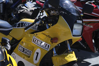 Yellow yamaha rd 350 motorcycle with racing numbers