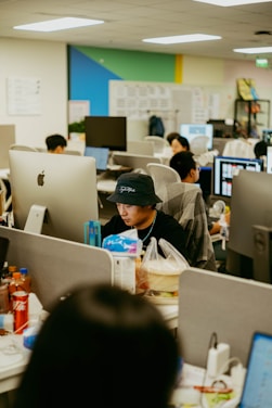 People working at computers in a modern office.