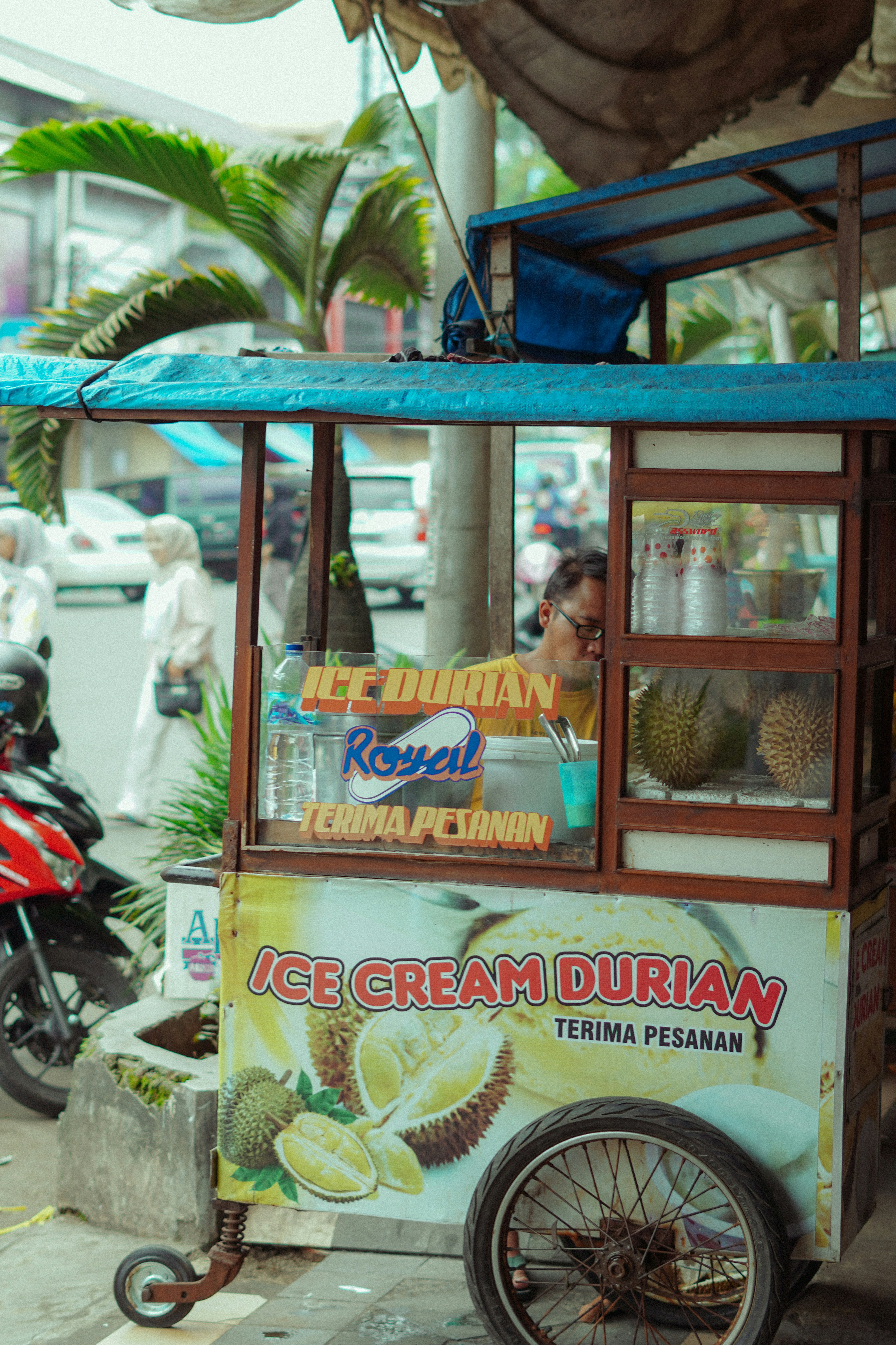 Street vendor sells ice cream durian from cart